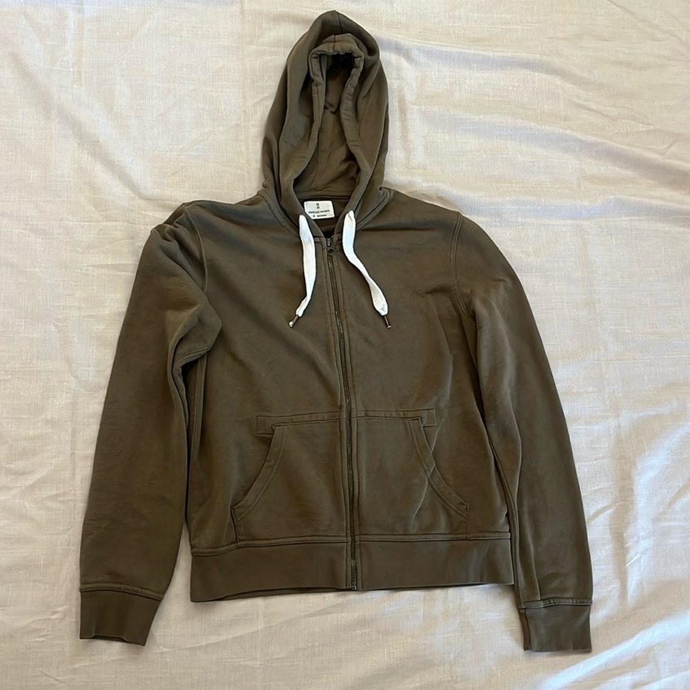 Olive green zip up hoodie with white laces, used once but in very good condition